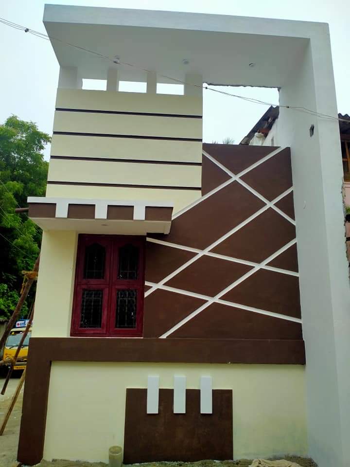 G+1 modern home with geometric brown and cream facade design in Kumbakonam