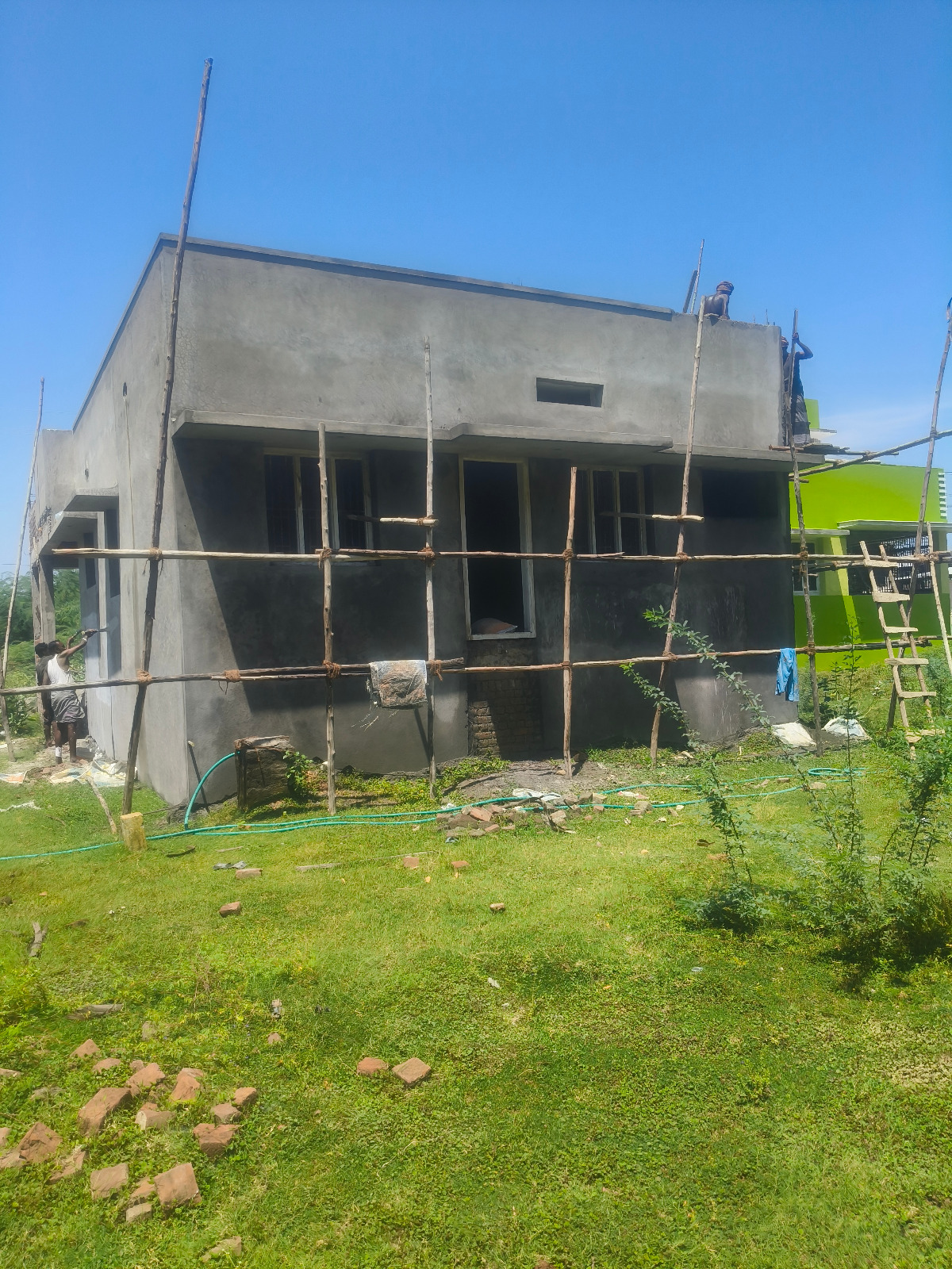 New single-storey home under construction with bamboo scaffolding in Papanasam